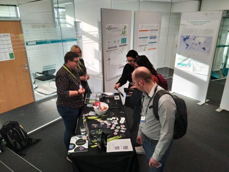 Booth from the Euro-BioImaging BioHub Team in a conference, featuring Johanna Bischof (left, front) and Claudia Pfander (left back)