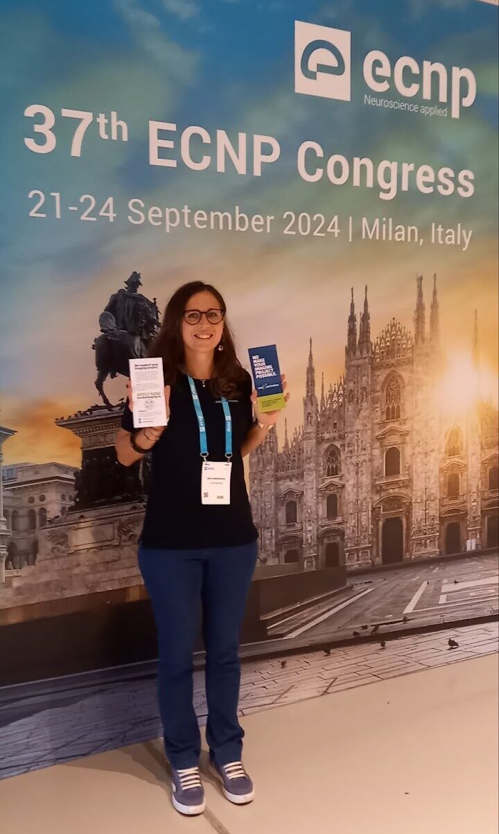 Alice Abbondanza at ECNP in Milan, with Euro-BioImaging brochures. 